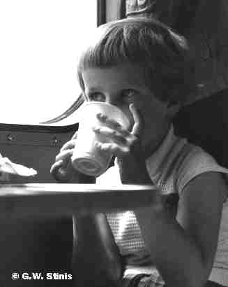 Jenneke drinking glass water in train